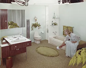 Legs Crossed At Knee Gallery: Woman in domestic bathroom