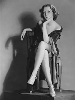 Legs Crossed At Knee Gallery: Woman posing in lingerie (B&W), portrait
