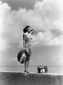 Woman Wearing Knit Bathing Suit Standing Wall Ocean Sea Background Holding Sun Hat Beach Woman Wearing Knit Bathing Suit Standing Wall Ocean Sea Background Holding Sun Hat Beach