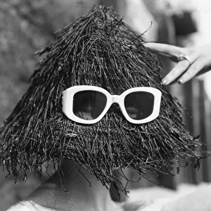 Yeti Hat; A black spaghetti straw hat, a summer beach fashion from Italy Yeti Hat; A black spaghetti straw hat, a summer beach fashion from Italy