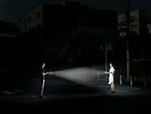 young couple with flashlights