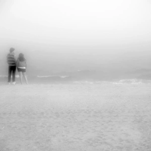 young couple standing ashore of Coney Island beach young couple standing ashore of Coney Island beach