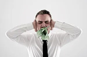 Young, desperate man wearing a shirt and a tie holding his hands over his ears, has Young, desperate man wearing a shirt and a tie holding his hands over his ears, has