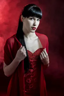 Young woman with long black hair in a red dress Young woman with long black hair in a red dress