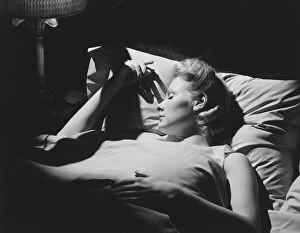 Closed Eyes Gallery: Young woman sleeping in bed (B&W)