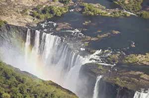 Zambezi River flowing over Victoria Falls, aerial view Zambezi River flowing over Victoria Falls, aerial view