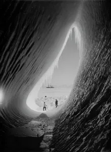 Antarctic Expedition Prints: Print of Grotto in an iceberg with Terra Nova in the distance