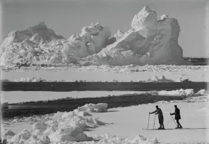 Iceberg in pack ice. Frank Debenham and T. Griffith Taylor on the ice. December 20th 1910 Iceberg in pack ice. Frank Debenham and T. Griffith Taylor on the ice. December 20th 1910