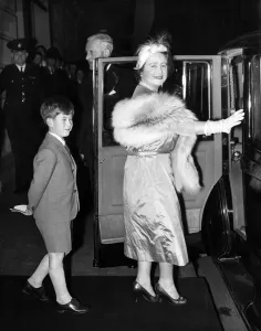 20 October 1956 Prince Charles follows the Queen Mother to their car after watching 20 October 1956 Prince Charles follows the Queen Mother to their car after watching