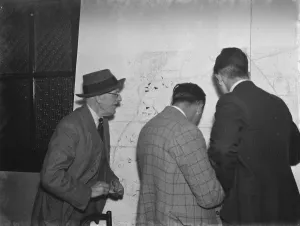 ARP ( Air Raid Precautions ) wardens in Crayford, Kent, looking at maps of the area ARP ( Air Raid Precautions ) wardens in Crayford, Kent, looking at maps of the area