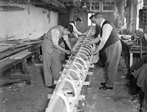 Images Dated 27th August 2015: The Boat Race 1933 The Cambridge Boat under construction at Sims boathouse on 2