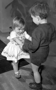 Boy and girl toddlers playing together dancing partners dance / dancing / party season Boy and girl toddlers playing together dancing partners dance / dancing / party season