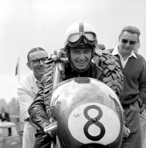 Brands Hatch, Kent: German Motor cycle racing ace, Ernst Degner has a smile of victory Brands Hatch, Kent: German Motor cycle racing ace, Ernst Degner has a smile of victory