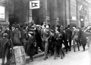 Crowds stand outside the White Star Line office in Leadenhall Street, waiting for Crowds stand outside the White Star Line office in Leadenhall Street, waiting for