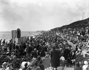 Crowds watch a Punch and Judy show on the beach at Clacton - on - Sea, Essex. 24 Crowds watch a Punch and Judy show on the beach at Clacton - on - Sea, Essex. 24