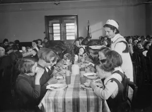 The dinner lady serving lunch at a girls school in Orpington, Kent. 1937 The dinner lady serving lunch at a girls school in Orpington, Kent. 1937