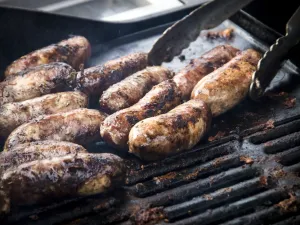 Free range pork sausages being grilled at Penshurst farmers market Free range pork sausages being grilled at Penshurst farmers market