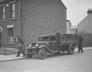 Terraced Houses Gallery: Gillingham Cooperative Society coal merchants making a delivery. 1938
