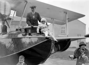 Prints of Squadron Leader Archibald Stuart MacLaren and his daughter standing in the Vickers Vulture amphibius bi-plane ( G-EBH0 ) at Carshot Spit, an RAF Seaplane Base near Southampton, Hampshire Southampton Prints: Vickers Vulture Amphibius Bi-Plane Print