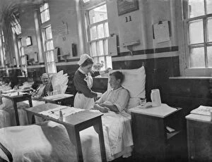 Young Collection: Gravesend Hospital in Kent. Nurse with a young patient. 1939