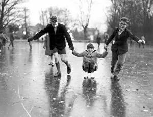 Having fun on the ice covered ponds at Chislehurst, Kent. The ice is about 12 inches