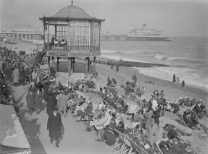 Holiday beach loungers at Eastbourne. So warm has been the weather on the south Holiday beach loungers at Eastbourne. So warm has been the weather on the south