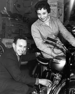 John and Dorothy Surtees in their family motorcycle shop 1950s John and Dorothy Surtees in their family motorcycle shop 1950s