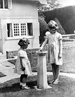 Images Dated 19th April 2002: Princesses Elizabeth and Margaret Rose in the grounds of the model house presented