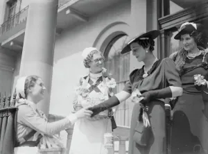 Prints of Alexandra Day, 1936. The Duchess of Kent, President of the Queen Alexandra Rose Day Fund, with rose sellers as she left home on her drive through London. 24 June 1936 Royalty Prints: Print of The Duchess of Kent with Rose Sellers in London, 1936