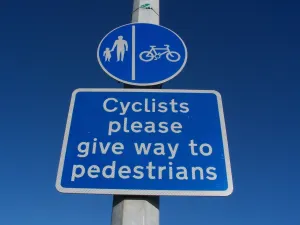 Sign with blue circle indicating segregated pedal cycle and pedestrian route with Sign with blue circle indicating segregated pedal cycle and pedestrian route with