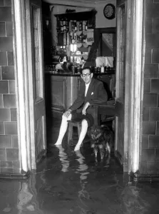 Thames Floods At Belvedere licensee of the Belvoir sits in his bar and watches the Thames Floods At Belvedere licensee of the Belvoir sits in his bar and watches the