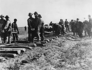 Track crew laying the track photographed at the 100th Meridian Photo by Carhutt Track crew laying the track photographed at the 100th Meridian Photo by Carhutt