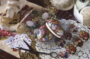 The Victorian art of decoupage - doileys, paper lace and flower designs cut out to decorate, in this instance an egg shaped box.
credit: Marie-Louise Avery / thePictureKitchen / TopFoto The Victorian art of decoupage - doileys, paper lace and flower designs cut out