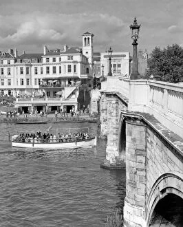 Riverside Gallery: A view of the river Thames from Richmond Bridge, London, England, with a pleasure