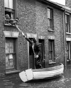 Bill Washford in a boat outside his house in Clyde Street Sheerness Kent fetch supples Bill Washford in a boat outside his house in Clyde Street Sheerness Kent fetch supples