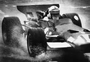Watkins Glen New York John Surtees heads into turn one during first day practice Watkins Glen New York John Surtees heads into turn one during first day practice