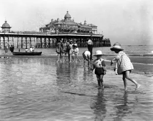 Paddling Gallery: Young children having holiday fun in the sea at Eastbourne. 9 August 1916
