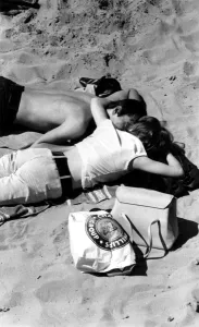 Young couple on the beach.. 1960s love couple romance romantic for valentines Young couple on the beach.. 1960s love couple romance romantic for valentines