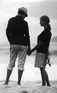 Young couple holding hands on the beach. love couple romance romantic for valentines Young couple holding hands on the beach. love couple romance romantic for valentines