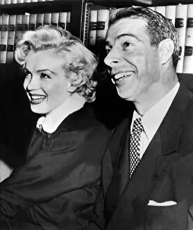 Celebrity & People Collection: American Actress Marilyn Monroe Poses with her husband Joe Di Maggio