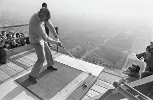 Golf Gallery: American Golfer Arnold Palmer kicks off from the second floor of the Eiffel Tower