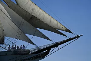 Crew members of Portuguese sailing boat Sagres sail in Tejo River in Lisbon on July 19