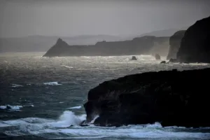 <b class=qtipBold><figcaption>New Zealand-Nature-Otago</figcaption></b><br>Rays of sun break through the clouds as waves crash against sheer cliffs on the Otago penisula coast near Dunedin, on September 12, 2011. AFP PHOTO / CHRISTOPHE SIMON / AFP PHOTO / CHRISTOPHE SIMON<br><em>© Copyright Agence France-Presse (AFP) - All Rights Reserved</em> New Zealand-Nature-Otago