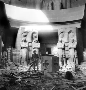 US soldier stands in the middle of rubble in the Monument of the Battle of the Nations in US soldier stands in the middle of rubble in the Monument of the Battle of the Nations in
