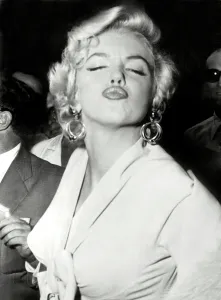 Prints of American actress Marilyn Monroe poses in front of the photographers, executing a very gracious grimace, on September 13, 1954 her arrival New York, where the star has not come for three years Actors And Actress Prints: Marilyn Monroe Print, 1954