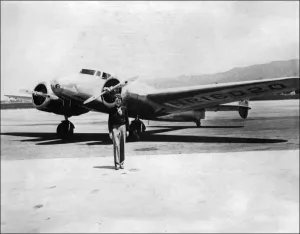 Prints of Undated picture taken in the 30s of American female aviator Amelia Earhart in front of her plane Pioneer Prints: Print of Amelia Earhart standing in front of her plane