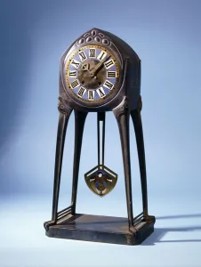 An Albin Muller (1871-1941) table clock, before 1904 (cast iron, bronze, enamel) An Albin Muller (1871-1941) table clock, before 1904 (cast iron, bronze, enamel)