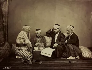 Album ' Damas et Baalbek ': A group of Syrians sitting around a table