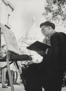The artist Maurice Utrillo painting at his easel in Montmartre, Paris, 1950's (photo) The artist Maurice Utrillo painting at his easel in Montmartre, Paris, 1950's (photo)