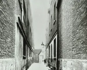 Prints of GHL1788018 Twyford Buildings: boy on steps, 1906 (b/w photo) by English Photographer, (20th century); London Metropolitan Archives, City of London; (add.info.: Twyford Buildings: boy on steps) Slums Prints: Twyford Buildings Black and White Print, 1906